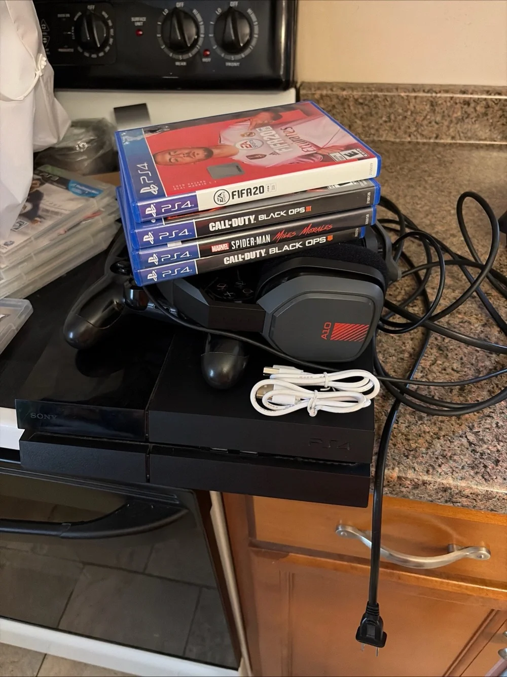 Sony PS4 500 GB (FAT) Bundle in Black W/Astro A10 Headset, Controllers & Games